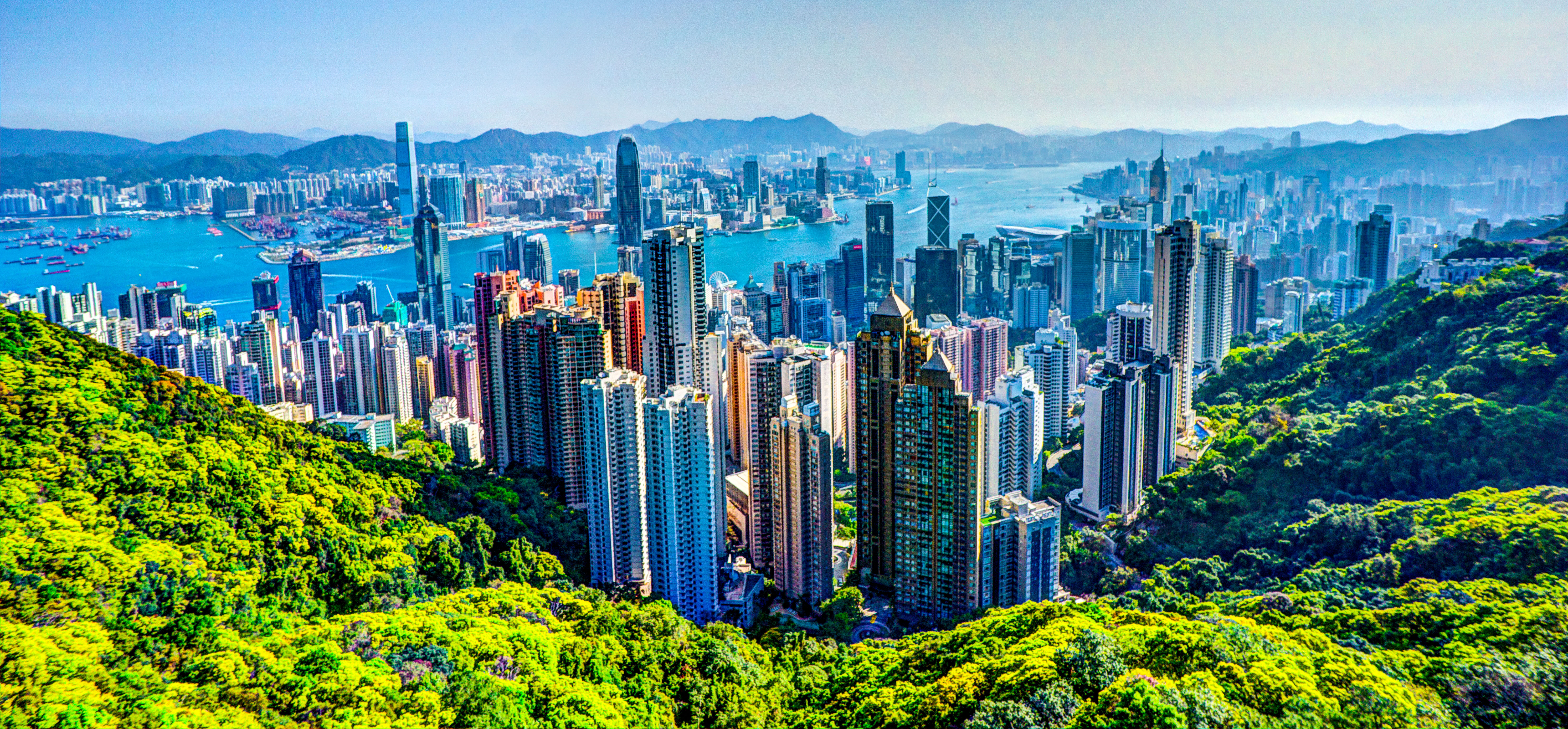 Aerial panorama of the Hong Kong skyline and harbor from Victoria Peak